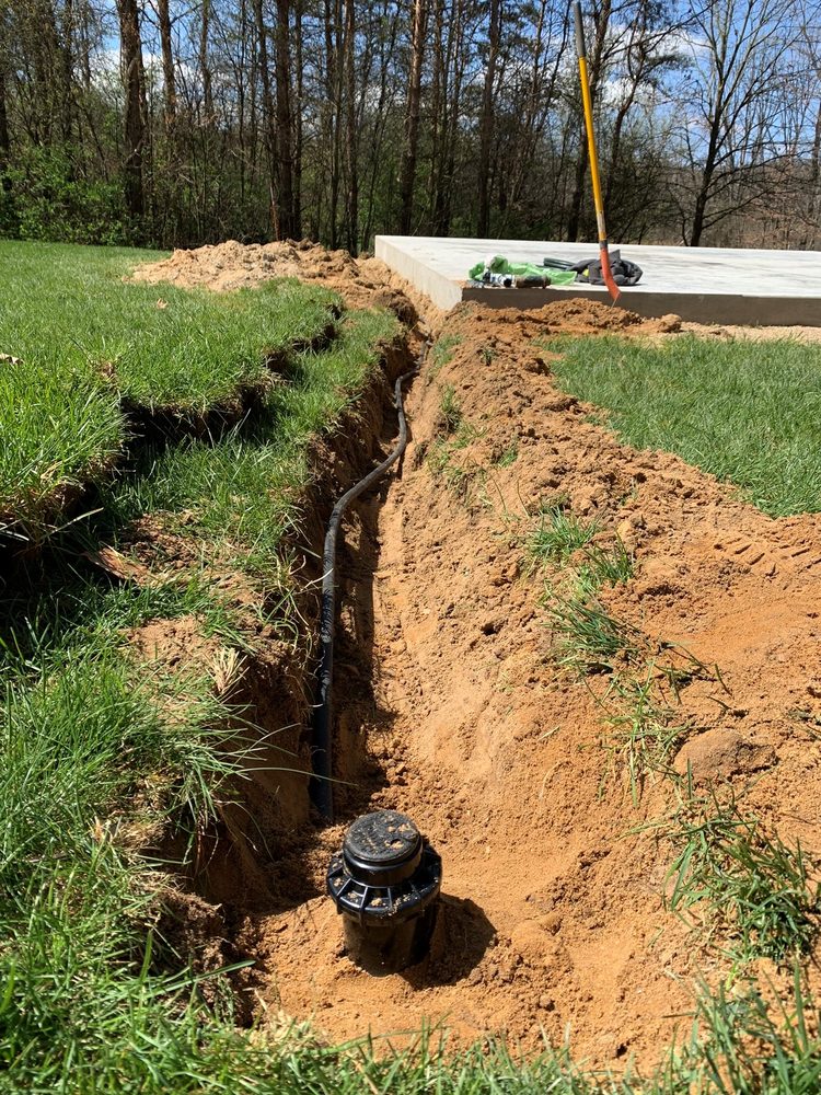 Sprinkler line trenching and valve installation